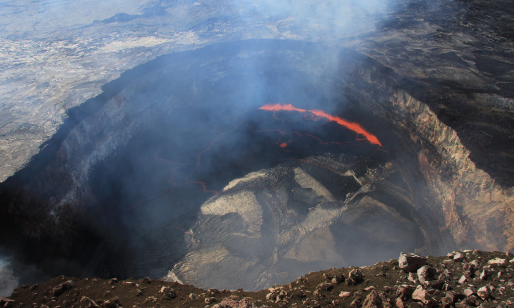 This USGS photo shows Kīlauea Volcano's summit lava lake, which continued to drop today (May 15, 2015). Measurements of the lake surface late this afternoon showed that it was 203 feet below the top of the newly-created vent rim. 