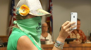 Woman wearing a makeshift face mask to demonstrate her opposition to GMO.
