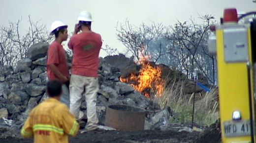Brushfire creeps closer to structures behind Kohanaiki Business Park