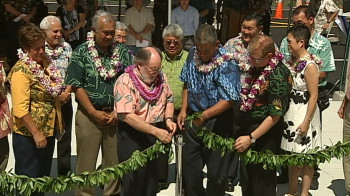 After the new student housing was blessed, officials untied the maile lei.