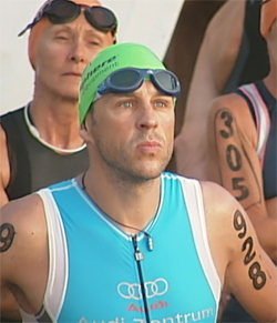 A triathlete prepares to enter the water before the start of the Ironman championship in 2008.