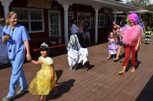 Lower School Head Heather Polhemus leads Parker lower schoolers during their costume parade through campus in Waimea, courtesy Parker School