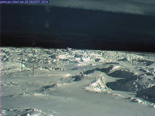 Snow covers the lava on Mauna Loa near the access gate to the observatory.