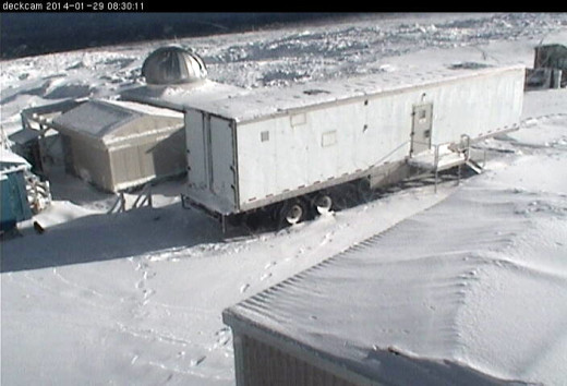 Snow covers the ESRL solar tracker on Mauna Loa, as well as the University of Denver building to the lower right.