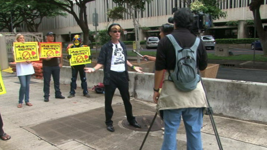 Brad "Tiki Shark" Parker does an interview with media outside the U.S. District Court on Oahu.