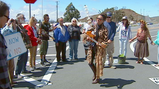 Demonstrators sing outside PTA gate