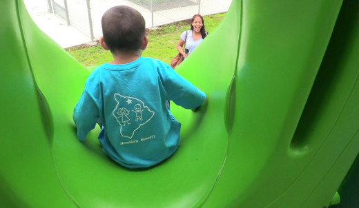 Keiki brave the slide at Honokaa's new playground.
