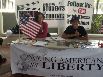 photo taken on the day of the incident, courtesy the UH-Hilo chapter of YAL. Merritt Burch is on the left behind the American flag.