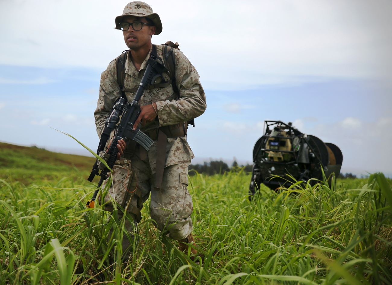 A marine and his machine. Lance Cpl. Brandon Dieckmann leads the LS3 in Hawaii (U.S. Marine Corps photo by Sgt. Sarah Dietz/RELEASED)