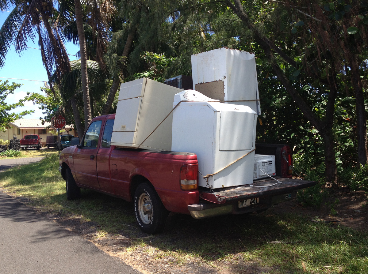 Even with power restored, many are still finding it hard to preserve food since their refrigerators were washed away. This truck was apparently collecting the various fridges and freezers found sprawled around the subdivision. 