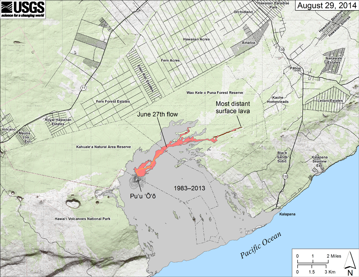 Map showing the June 27th flow in Kīlauea’s East Rift Zone as of August 29, 2014. The area of the flow as mapped on August 28 is shown in pink, while widening and advancement of the flow as of August 29 is shown in red. All older lava flows (1983–2014) are shown in gray. The thin yellow line marks a portion of the lava tube feeding the flow. The brown line at the far end of the flow marks the ground crack that has channeled lava to the east. Over the past day, lava has emerged from this ground crack with a small amount spilling onto the surface. The farthest reach of this lava, marked on the map, was 11.9 km (7.4 miles) from the vent and 2.6 km (1.6 miles) from east boundary of the Wao Kele o Puna Forest Reserve. (USGS HVO)