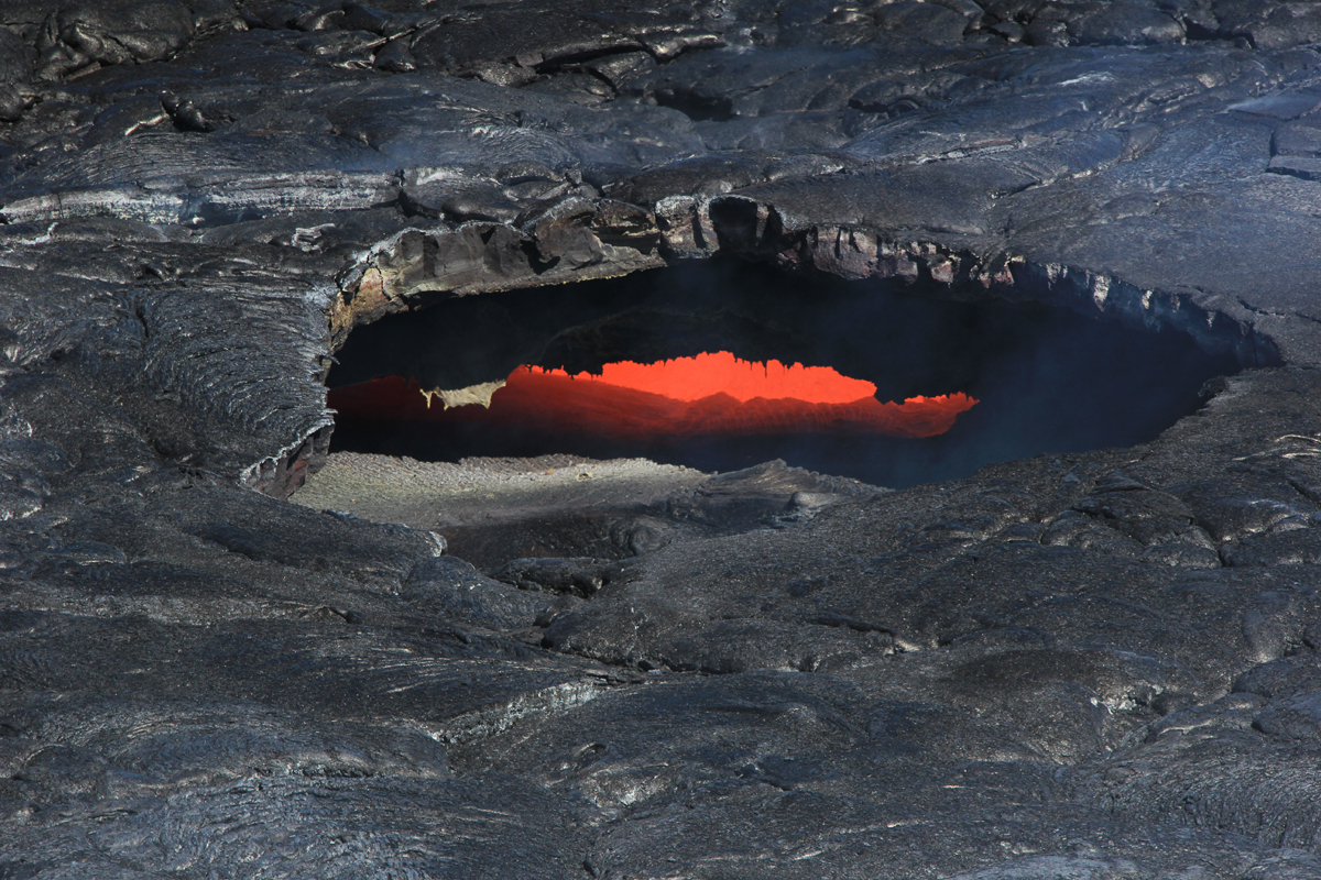 USGS reports several skylights "provided views into the June 27th lava tube today, and the fluid lava stream could be seen moving downslope."