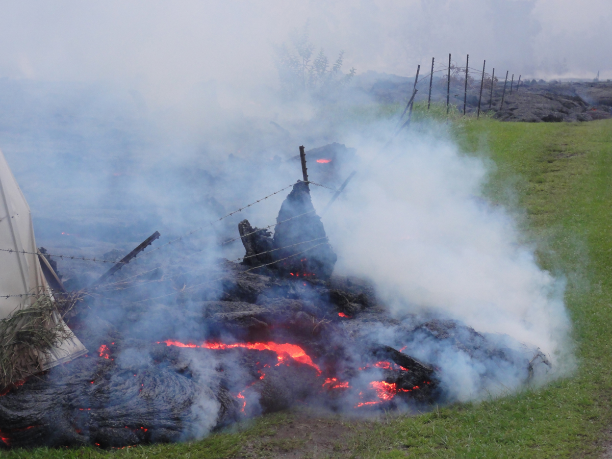 USGS says some of the flow front had the appearance of "slabby" pāhoehoe, which is the type of pāhoehoe in which the surface consists of numerous broken, overturned slabs. One of the rotated surface slabs presses against the fencing that runs along the small road to the cemetery.