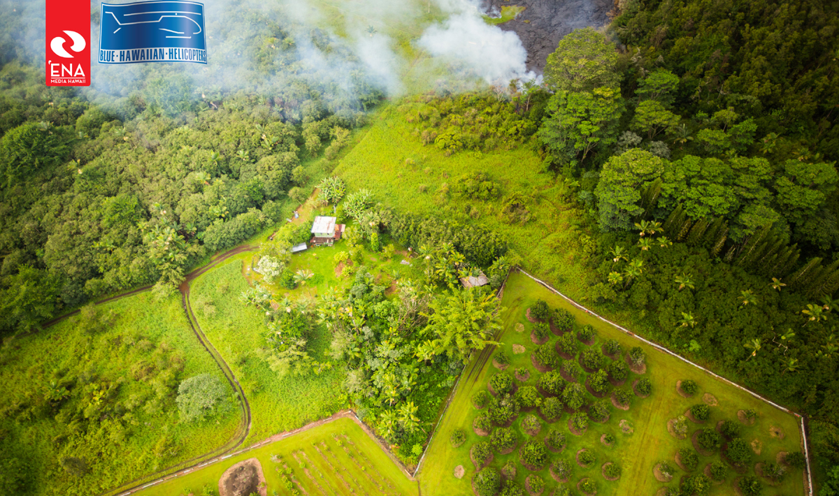 Aerial photo of the lava flow approaching a residential home in Pahoa on October 27. Courtesy ‘Ena Media Hawai’i/Blue Hawaiian Helicopters.