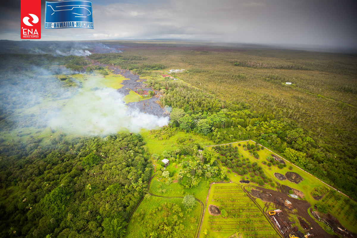 Aerial photo of the lava flow approaching a residential home in Pahoa on October 27. Courtesy ‘Ena Media Hawai’i/Blue Hawaiian Helicopters.