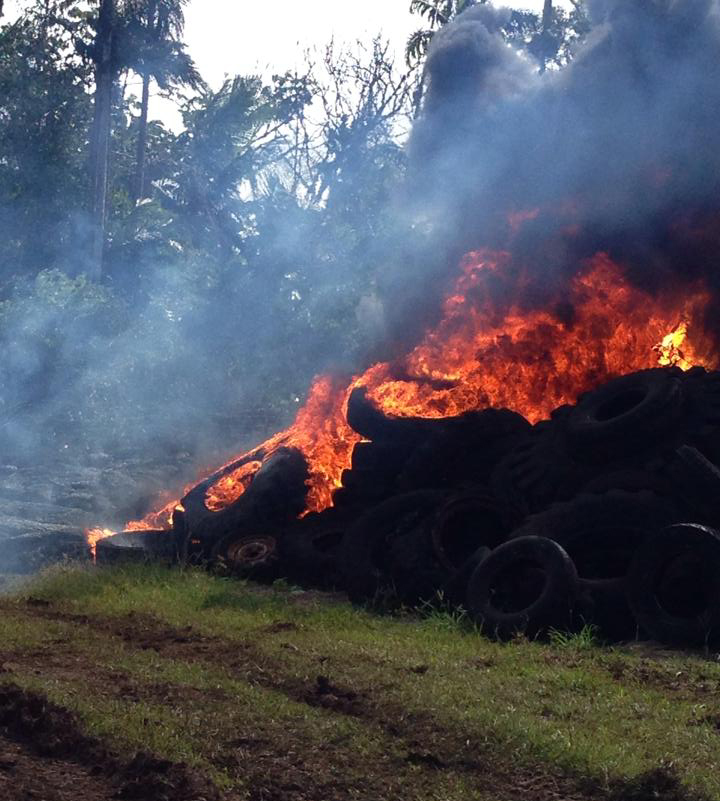 Burning tires as seen from the ground on Tuesday.