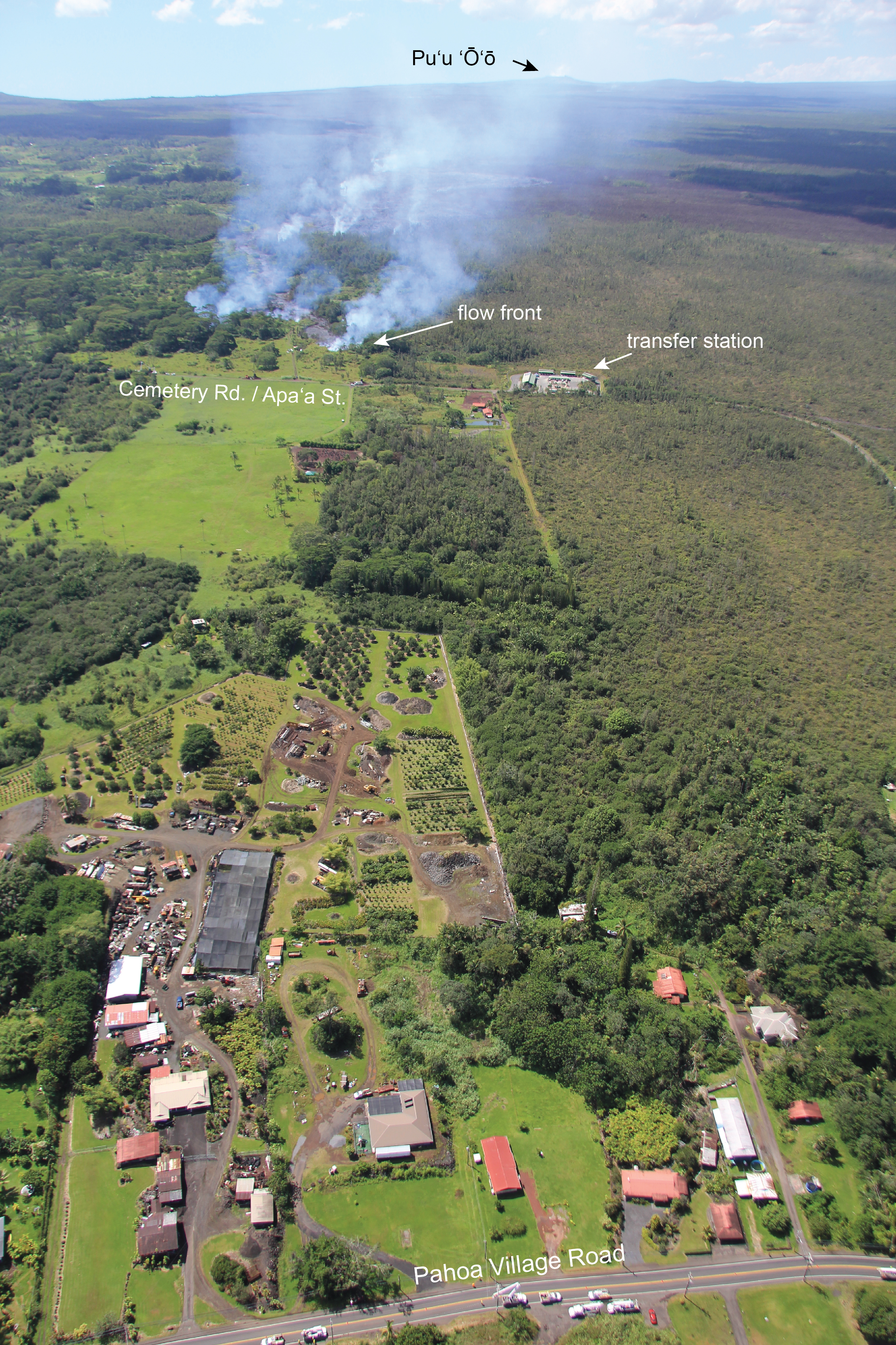 USGS HVO: A wider view of the flow front, and its position relative to Pāhoa. This morning the flow front was 1.2 km (0.7 miles) from Pāhoa Village Road, as measured along a straight line. Pāhoa Village Road is at the bottom of the photograph.