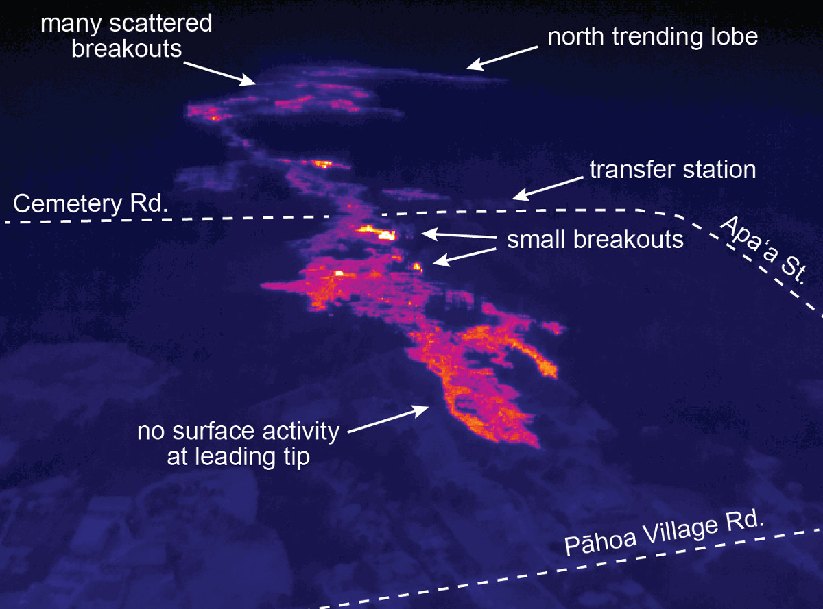 This USGS HVO photo is a thermal image of the flow front. The warm (but not hot) temperatures (red and orange) around the leading tip of the flow indicate that no surface flows are active in this area. Several small breakouts are active a short distance upslope, near the cemetery, and are visible by their higher temperatures (yellow, white). Upslope of Cemetery Rd./Apaʻa St., scattered breakouts remain active. A lobe about 2.5 km (1.5 miles) upslope of Cemetery Rd./Apaʻa St. has expanded the flow margin towards the north.