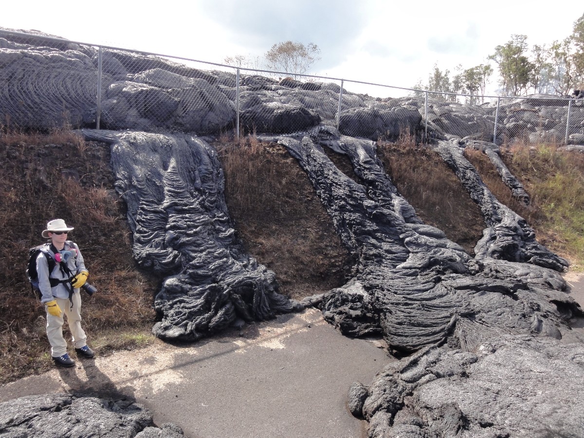 This USGS photo shows lava stalled at the Pahoa transfer station fence line, where it subsequently inflated to a height slightly greater than that of the fence.