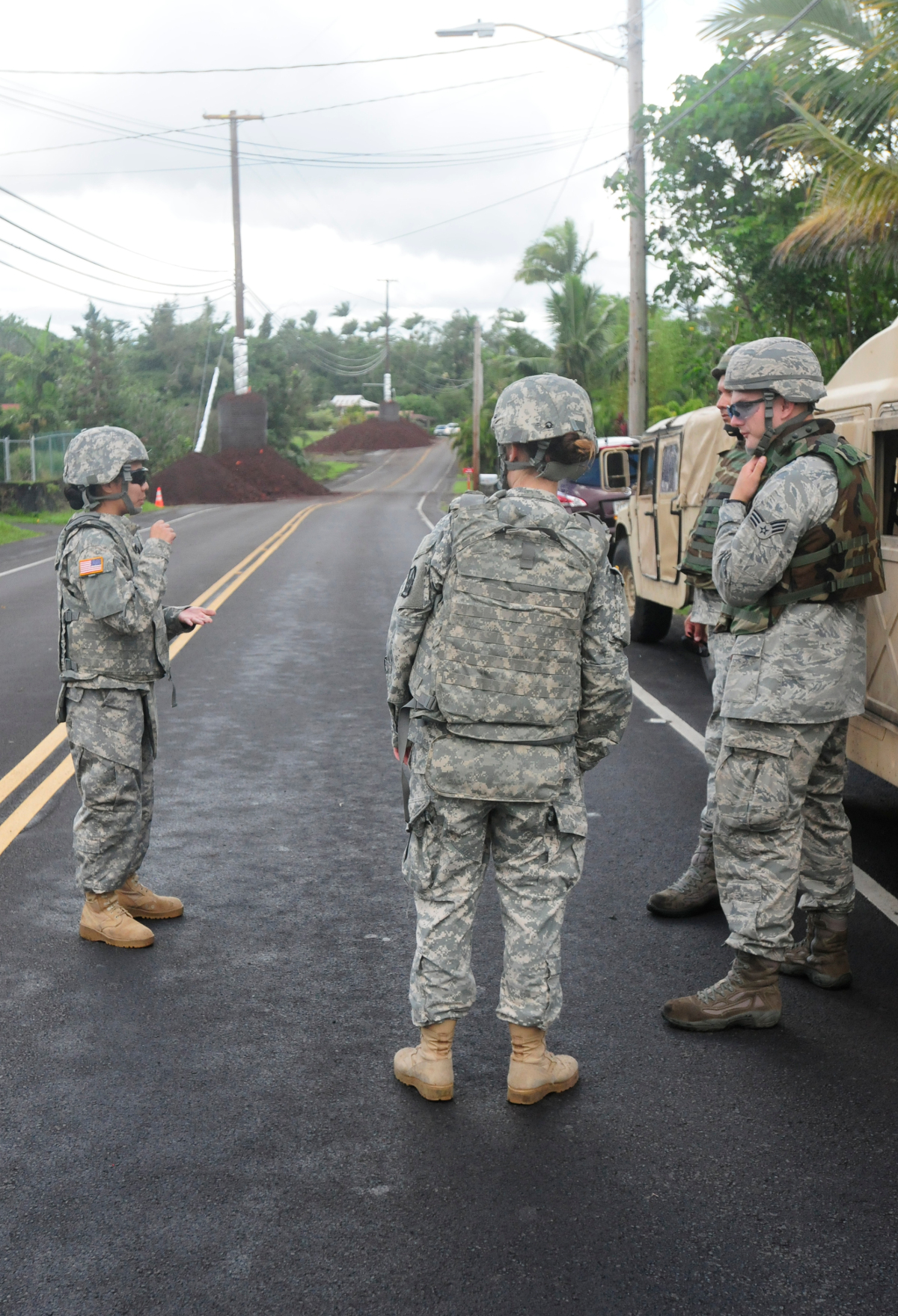 Pfc. Debney Jaramillo briefs her team prior to patrols in Puna, Hawaii, Oct. 30, 2014.  (U.S. Army National Guard photo by Staff Sgt. Katie Gray/Released)