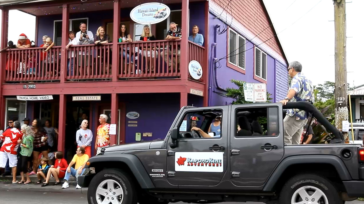 The crowd cheers the hard-working Civil Defense administrator Darryl Oliveira during Saturday's holiday parade in Pahoa.