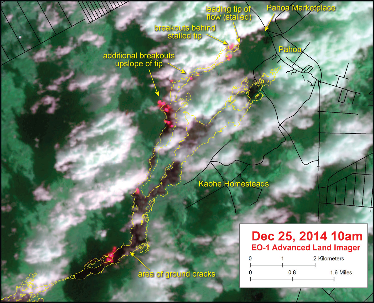 This USGS satellite image was captured on Thursday, December 25, by the Advanced Land Imager instrument onboard NASA's Earth Observing 1 satellite. Although this is a false-color image, the color map has been chosen to mimic what the human eye would expect to see. Bright red pixels depict areas of very high temperatures and show active lava. White areas are clouds. The yellow outline is the flow margin as mapped on Monday, December 22. 