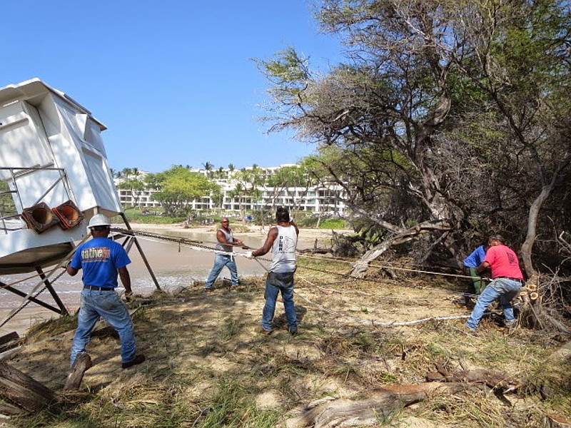 State Parks crew relocate lifeguard stand at north side of Hapuna beach. Photo by Division of State Parks