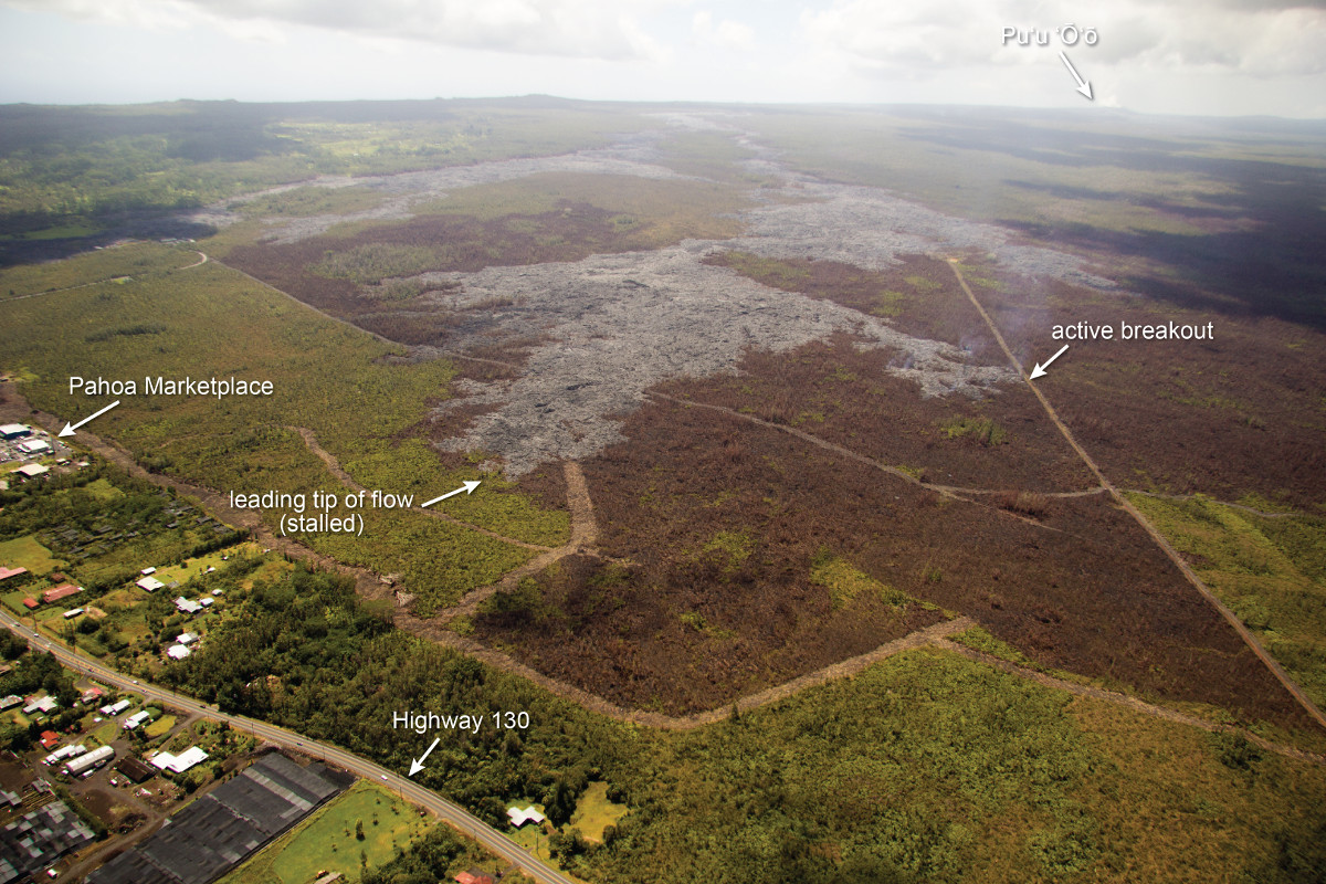 Feb. 23, 2015 (USGS) - The leading tip of the June 27th lava flow remains stalled, but breakouts persist upslope of the stalled tip. Today, one of these breakouts (marked by the arrow) had advanced a short distance towards the north, reaching one of the fire break roads.