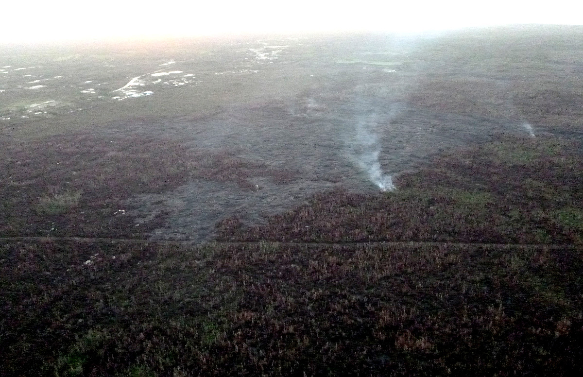 March 3, 2015: Civil Defense image from this morning’s overflight - view from the north flow margin, looking down slope towards Highway 130 and Pahoa Marketplace.