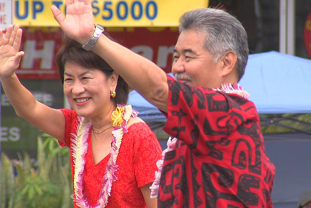 Governor David Ige and his wife Dawn in the Merrie Monarch Parade on Saturday.
