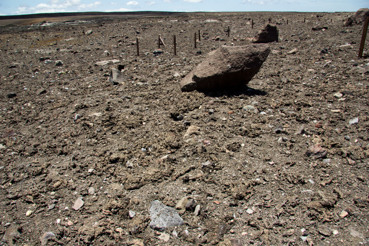 A closer look at the Halemaʻumaʻu Crater overlook. The large boulders were ejected during the 1924 explosion, but today's explosive event carpeted the ground with many large pieces of brown spatter. (USGS photo)