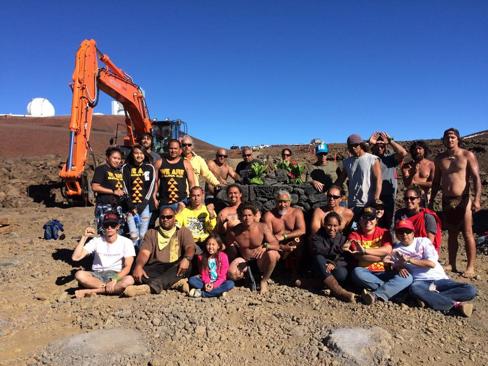 Builders of the first ahu pose by their finished work near the TMT site on Mauna Kea, photo by Ku'uipo Freitas on June 22, 2015.