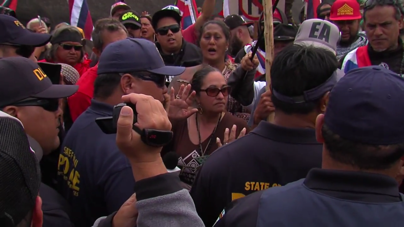 Pua Case, whose family is an appellant in the legal contest to the TMT permit, stands with protectors on Mauna Kea on June 24th.