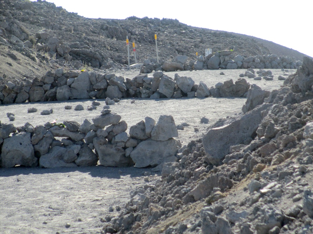 UH provided this photo of the rock walls made on the Mauna Kea Access Road after the June 24 arrests. Spokesperson Dan Meisenzahl said the four completed rock walls were removed, with the help of protectors. Governor David Ige called the structures "an act of vandalism". 