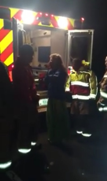 Cynthia Marlin by an ambulance on Mauna Kea, still image from Facebook video by "Na'au New Now"