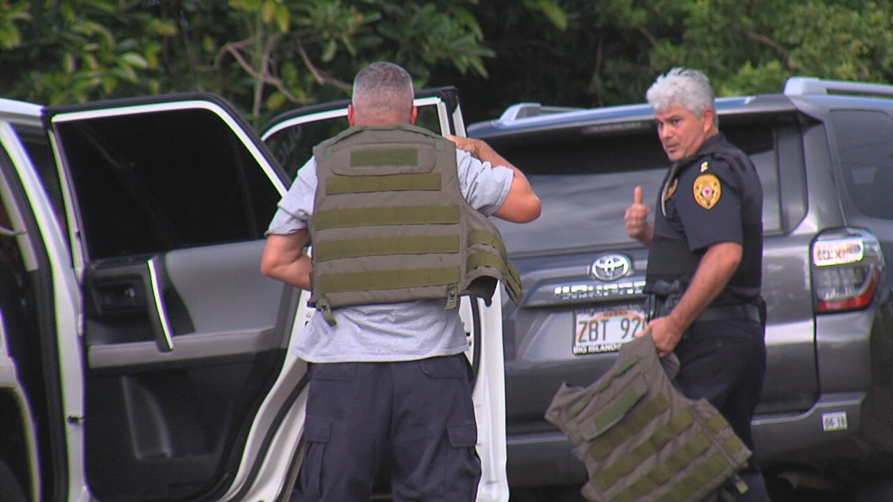 Police officers suit up before approaching the scene of the barricade in North Kohala on July 14.