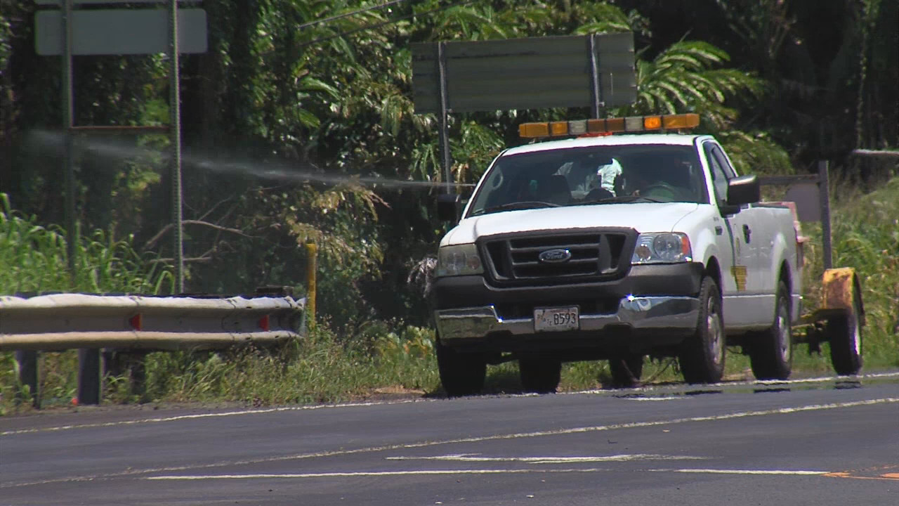 County truck filmed as it apparently sprays Roundup into the weeds along Highway 19 near Paukaa.