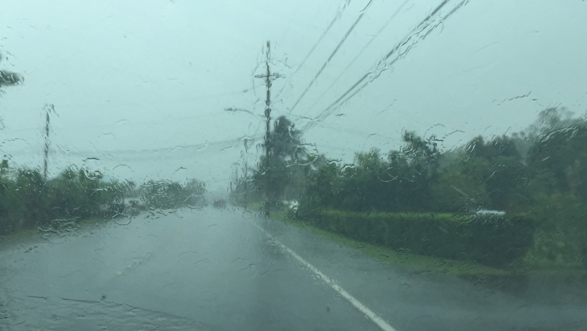 Rain pours in Hilo just before noon.