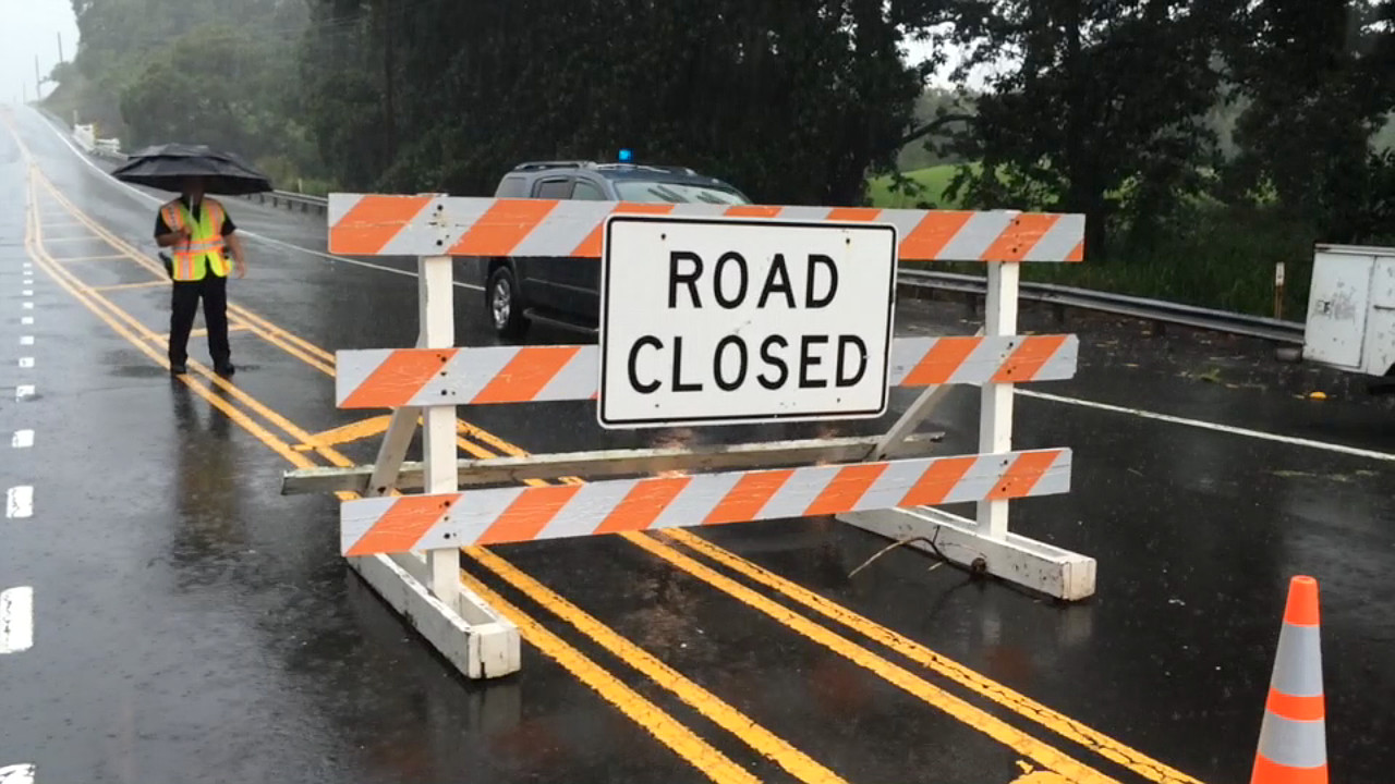 Tim Bryan captures the roadblock set up on Highway 11 near Punalu'u, when the road was closed due to flooding. The road is now open one lane.