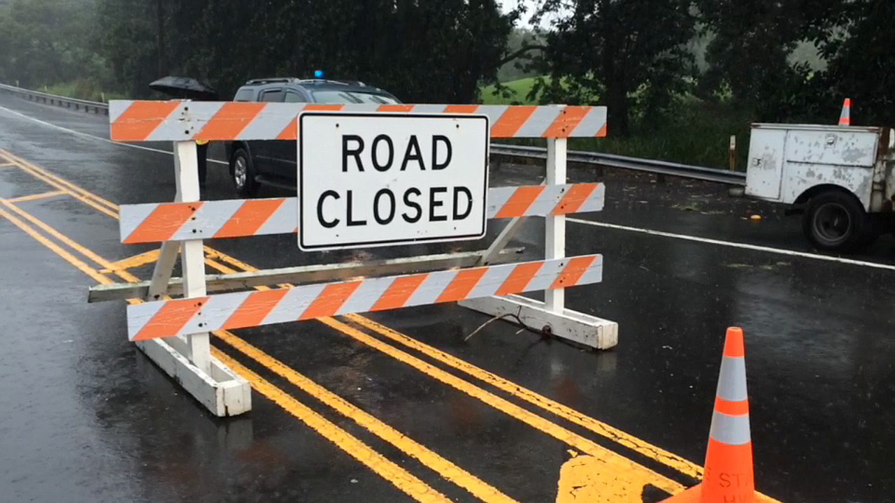 Recent file photo shows Highway 11 in Ka'u, closed due to flooding. Image by Tim Bryan.