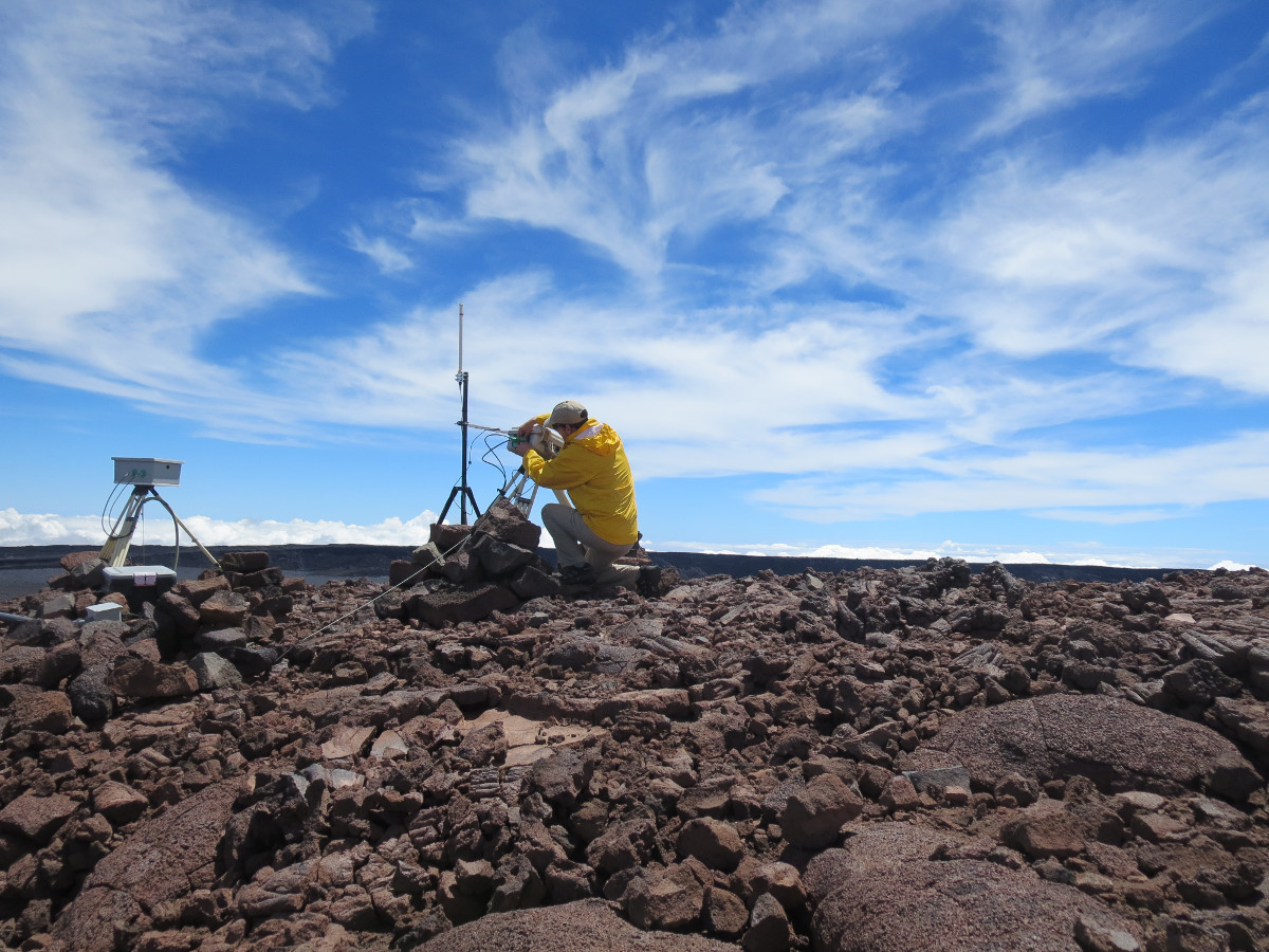 (USGS HVO) An HVO geologist performs a routine check of the thermal camera and webcam at the summit of Mauna Loa.