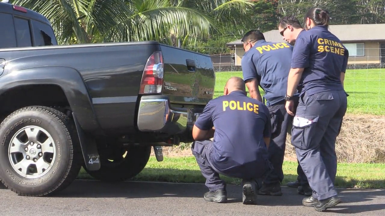 Police examine the damage to the rear of the Toyota Tacoma pickup truck, image from video courtesy Daryl Lee