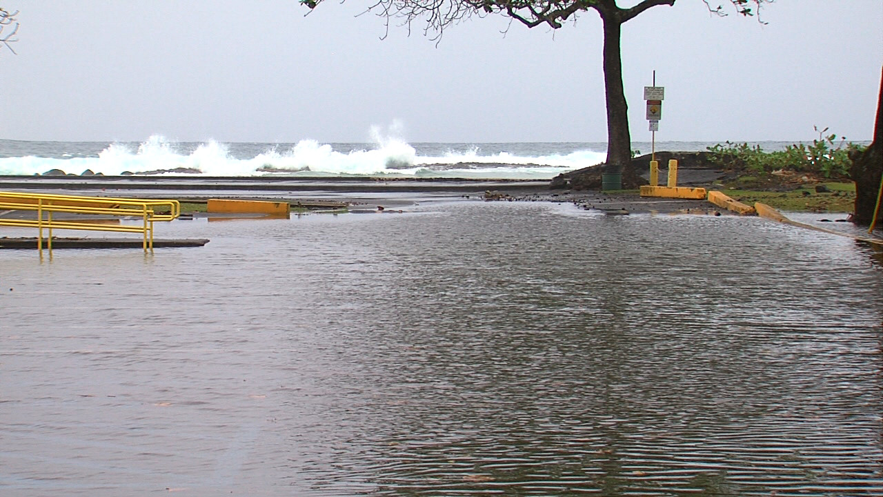 The parking lot by the horseshoe courts at Onekahakaha was flooded on Monday, not an uncommon sight during high surf events.