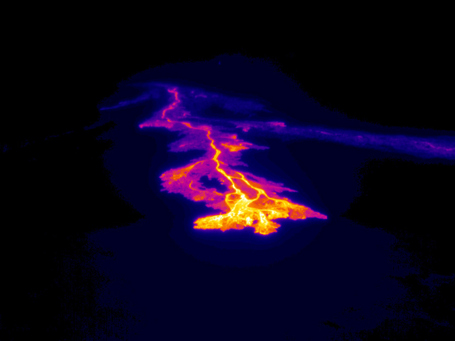 In this USGS thermal image of the northern breakout, scientists say the active lava channel and flow front are clearly revealed as bright yellow and pink colors. The channel that was active yesterday, but now stagnate, is visible as a bluish-purple line to the right of today's active flow.