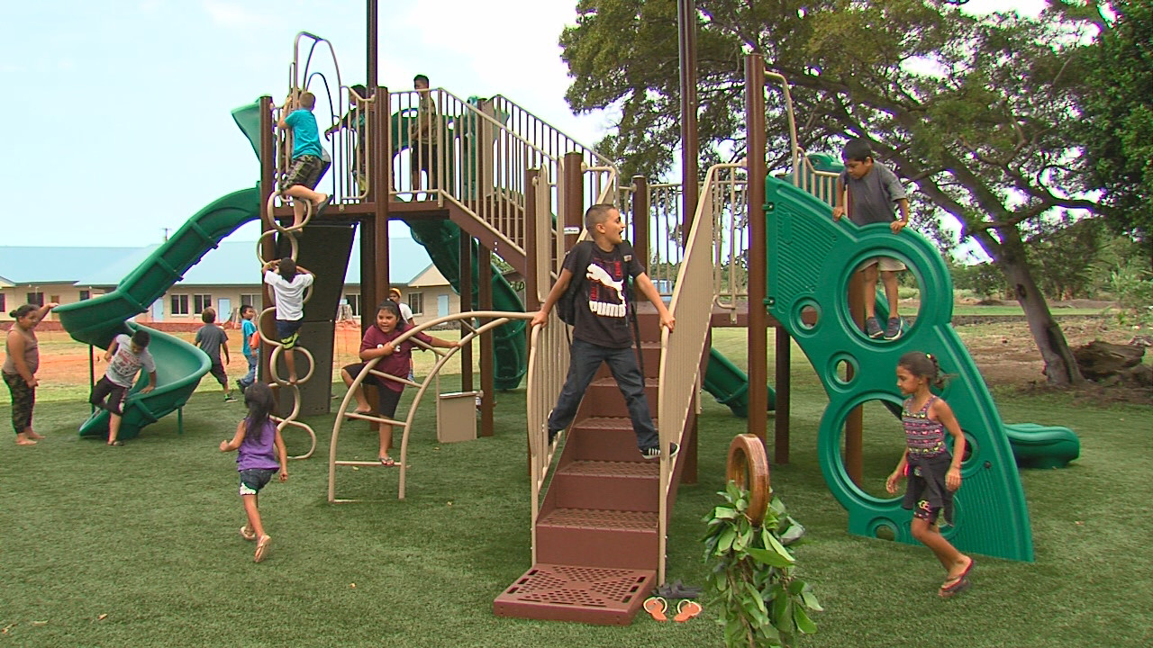 Kids play on the new Pahala playground