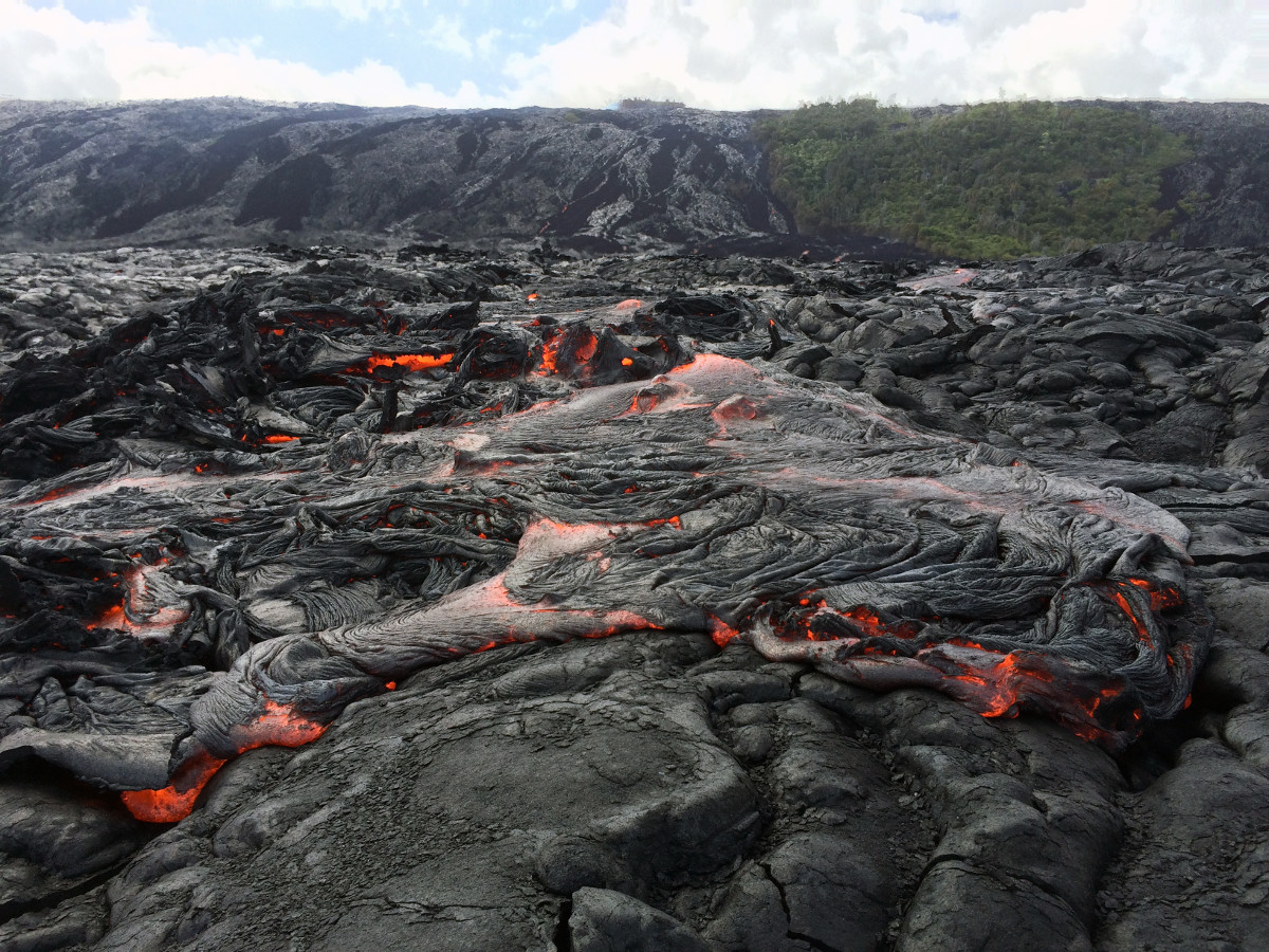 (USGS photo) On July 2, the flow front was roughly a quarter mile out from the base of the pali, and was 1.8 miles from the ocean. Scientists say the front consisted of slabby pāhoehoe, though ʻaʻā was also active at the base of the pali.