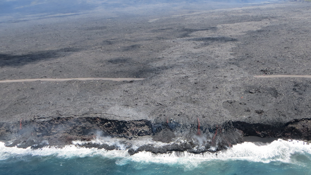 This USGS photo shows the two entry points observed Friday: the original one, where lava first entered the ocean on July 26 (near center of photo), and a smaller one to the west (far left side of photo).