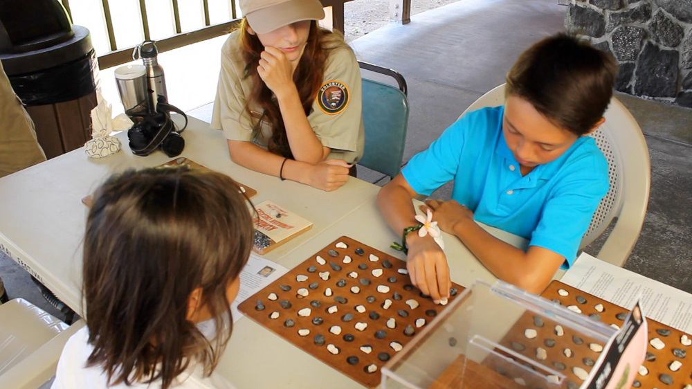 Keiki enjoy kōnane at the 100th anniversary of Hawai‘i Volcanoes National Park. NPS Photo/Sami Steinkamp 