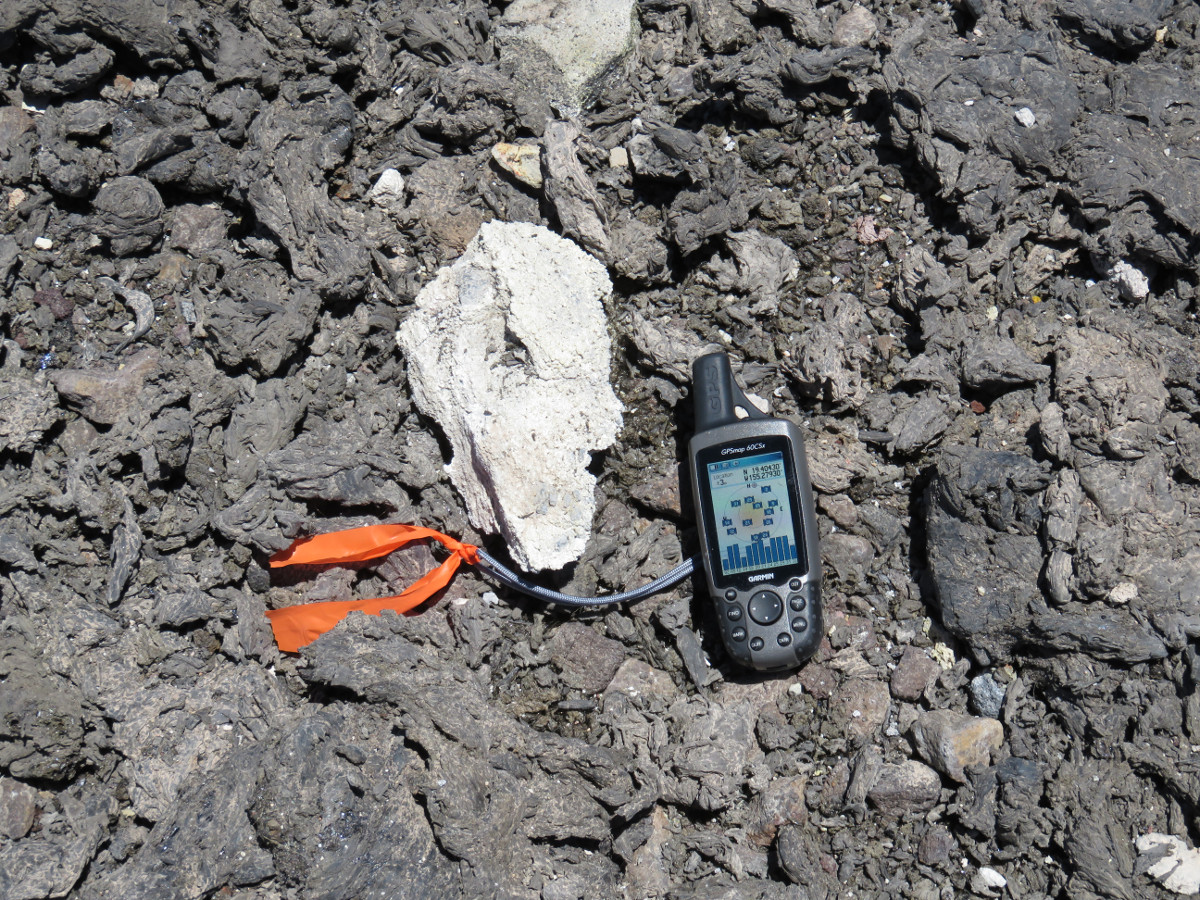 (USGS photo) The light-colored lithic in the center of this photo is about 20 cm (8 in) long—the GPS unit is shown for scale. 