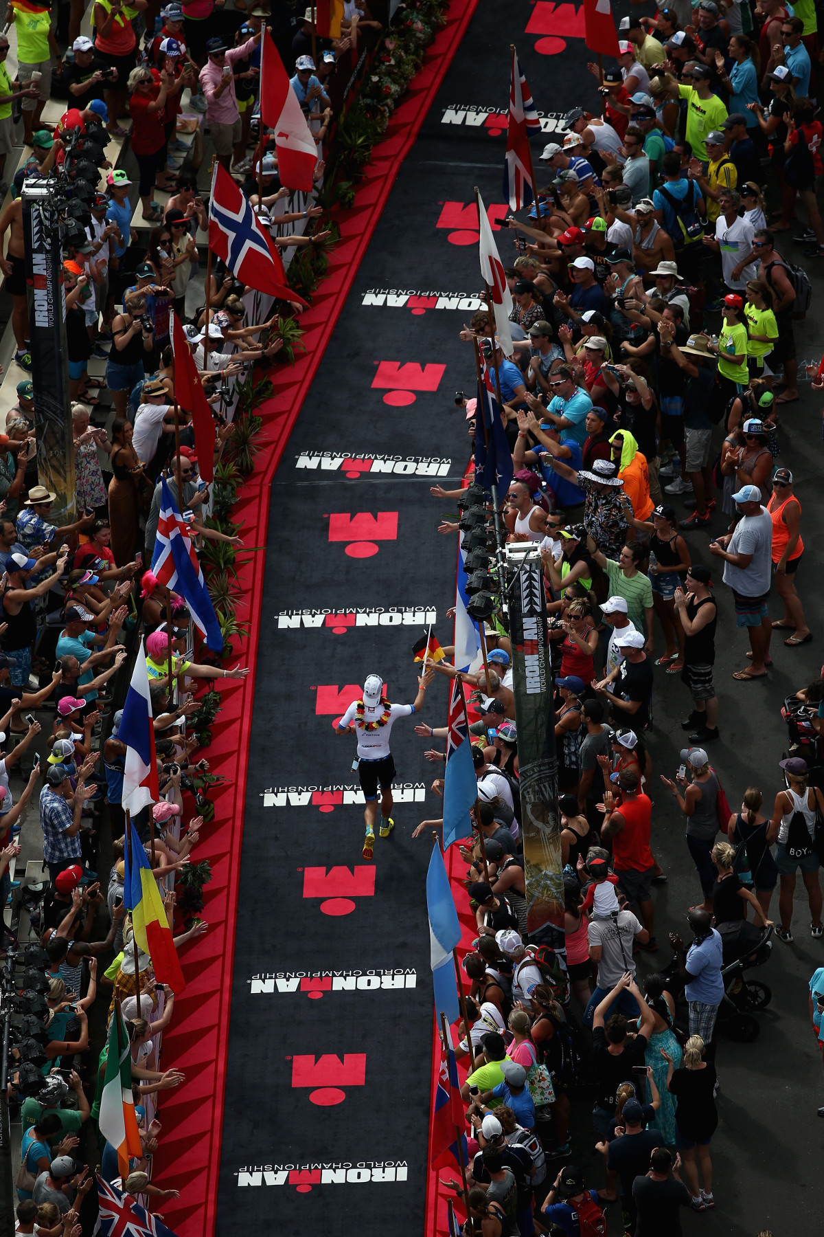 ROCKET MAN. Patrick Lange #20 of Germany competes in the 2016 IRONMAN World Championship triathlon on October 8, 2016 in Kailua Kona, Hawai'i. His 2:39:45 marathon time broke Mark Allen's run course record of 37 years (Photo by Sean M. Haffey/Getty Images for IRONMAN) –  Copyright © 2016 IRONMAN